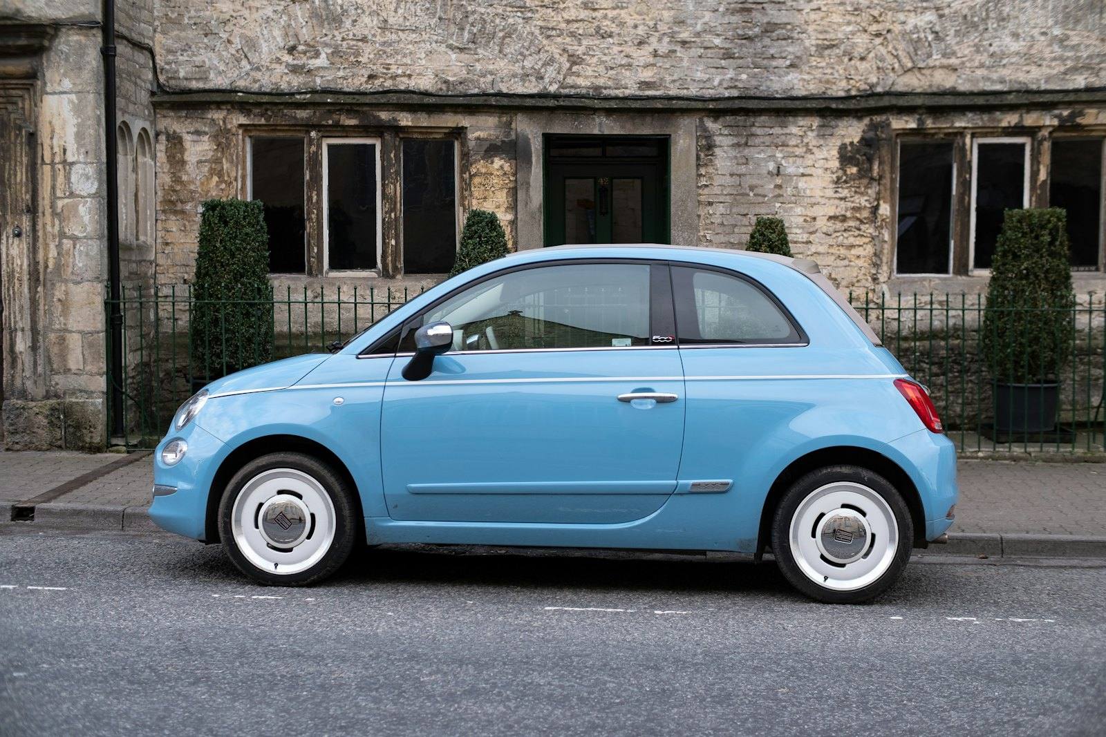 Light blue compact car parked on a street